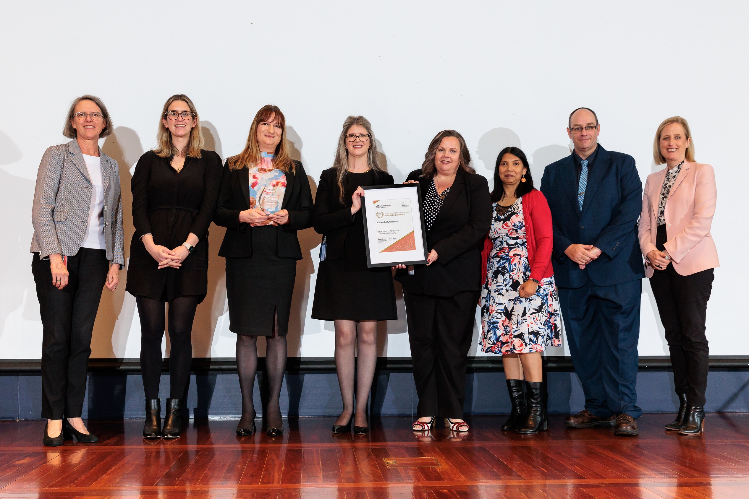 Photograph of Building Entity Capability Gold award recipients - Department of Agriculture, Fisheries and Forestry with the Minister for Finance and the Finance Secretary.