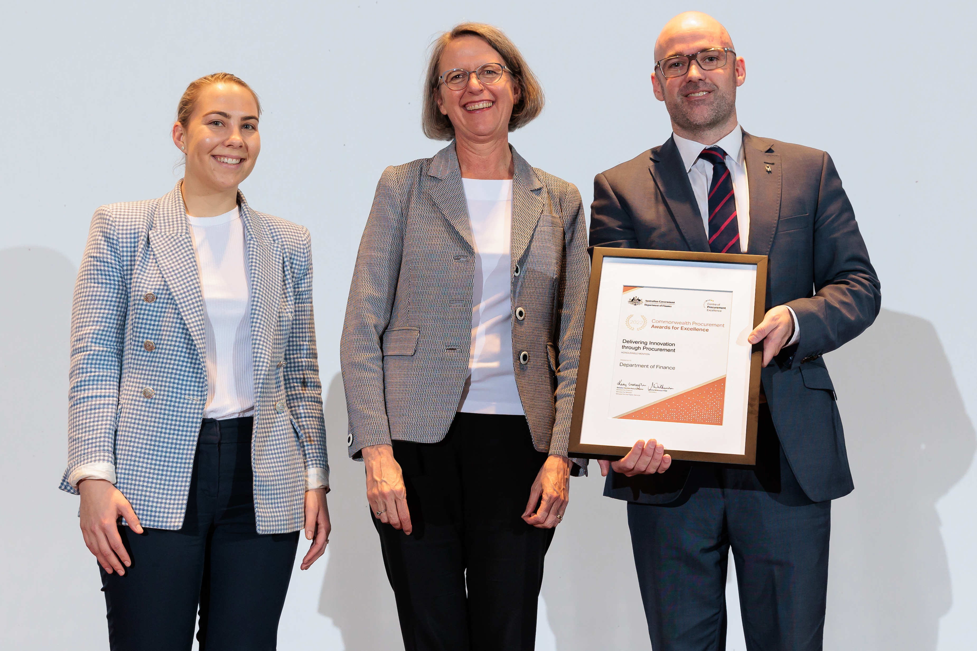 Photograph of Delivering Innovation through Procurement Honourable Mention award recipients – Department of Finance with the Finance Secretary