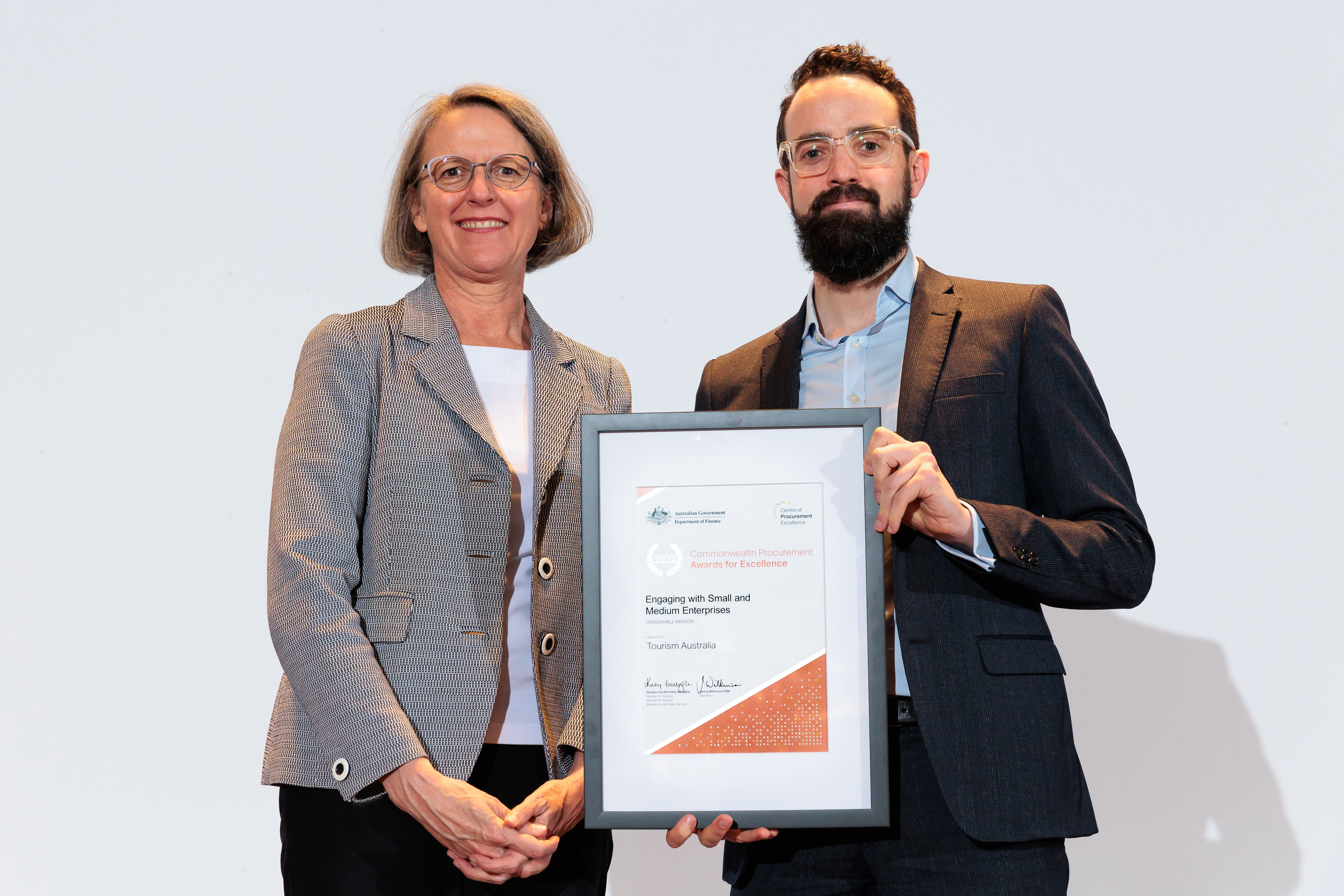 Photograph of the Engaging with SMEs Honourable Mention award recipients – Tourism Australia with the Finance Secretary