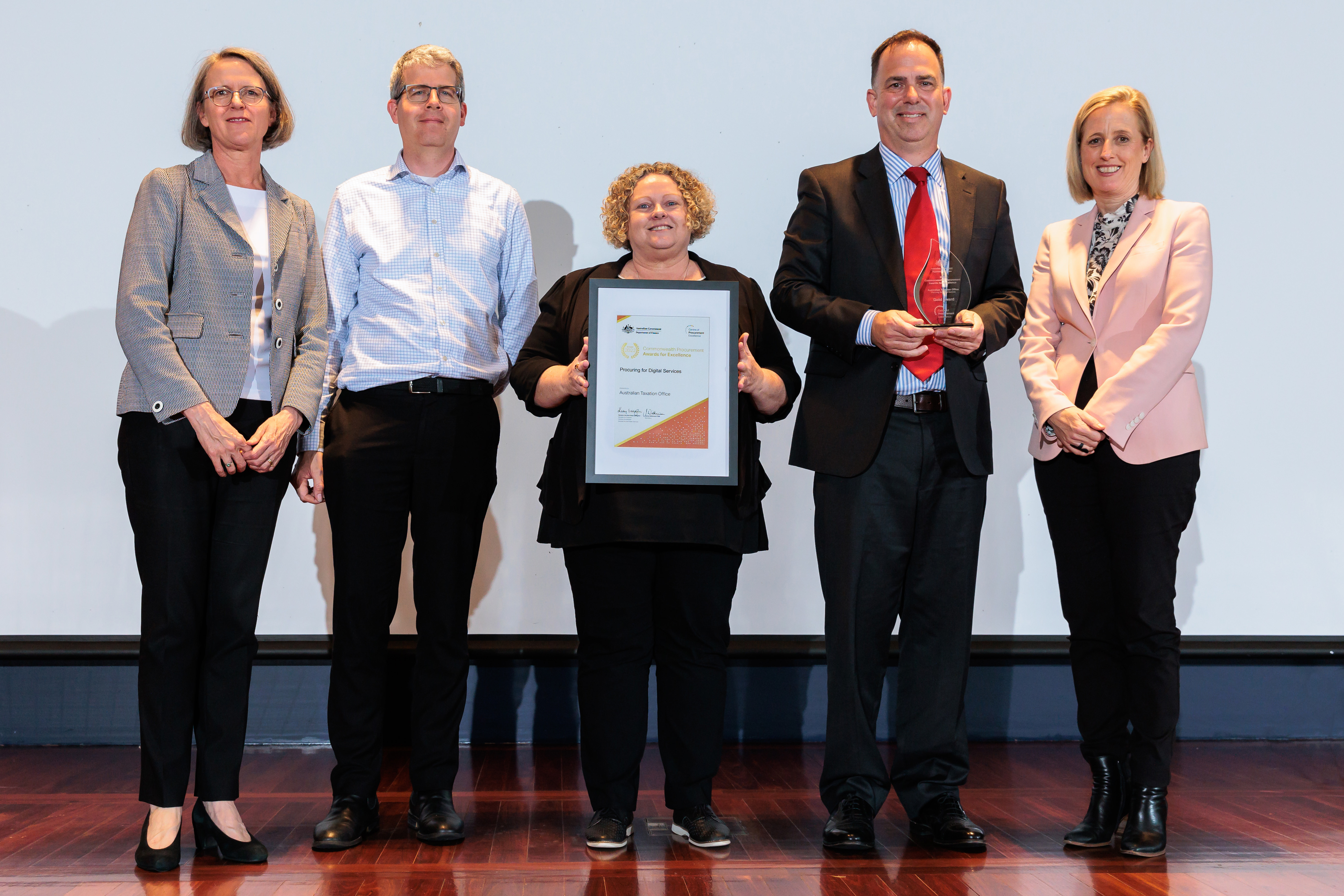 Photograph of the Procuring for Digital Services Gold award recipients – Australian Taxation Office with the Minister for Finance and the Finance Secretary